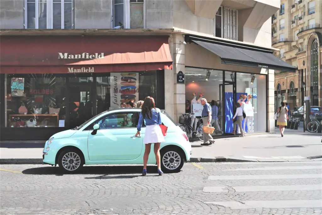 woman getting into a car