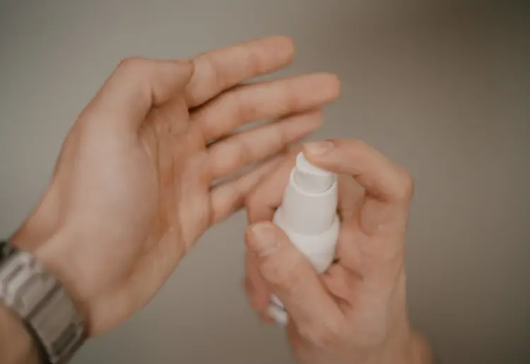 woman applying hand cream