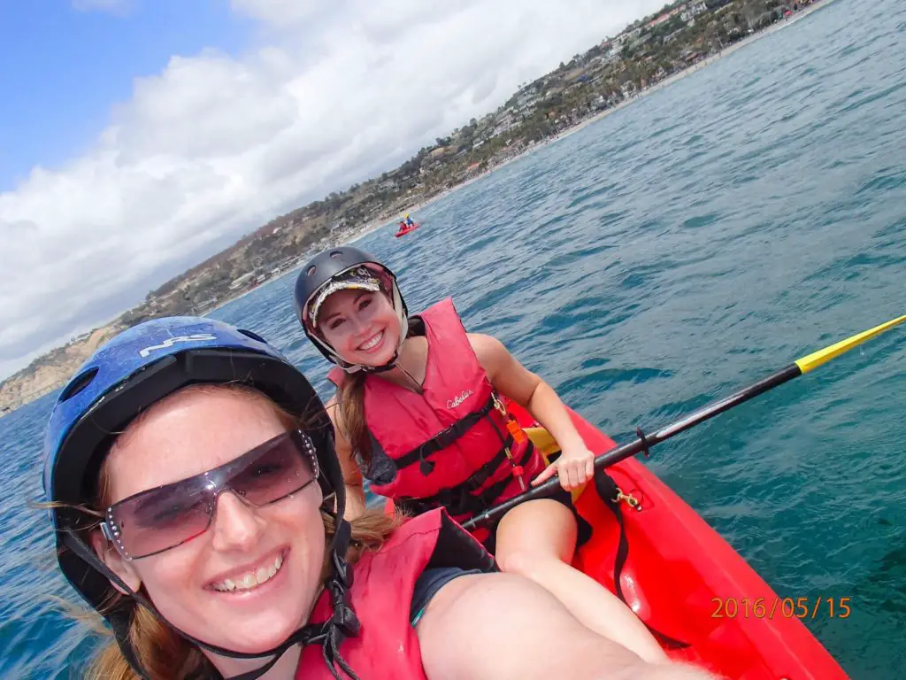 two girls kayaking in san diego for a girls weekend