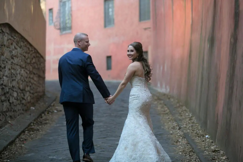 bride and groom walking away