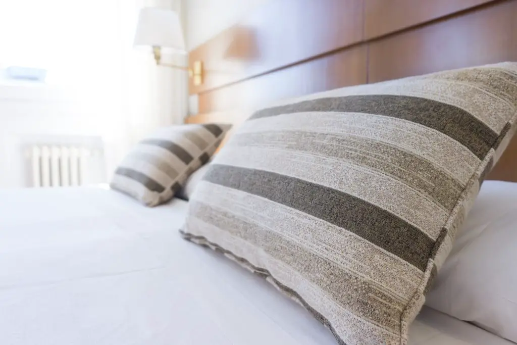 hotel room bed with pillows