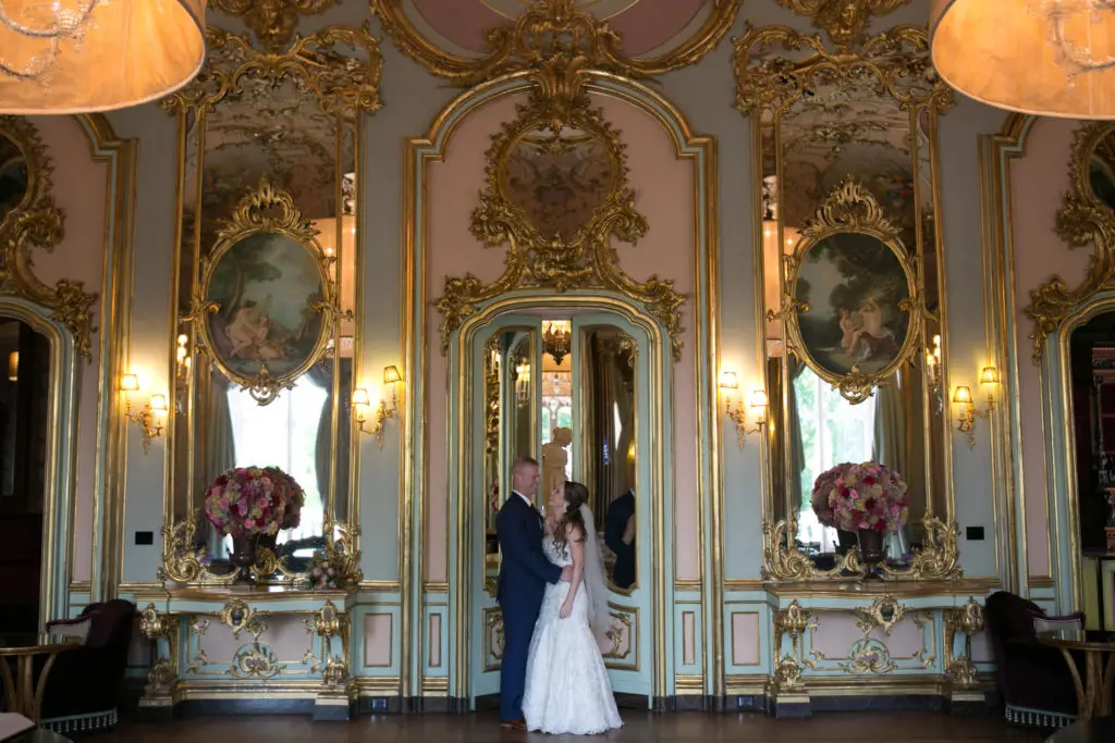 newlyweds in hotel ballroom after wedding ceremony