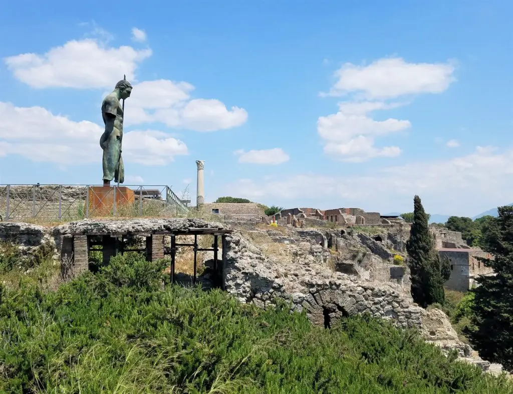statue on hillside at pompeii
