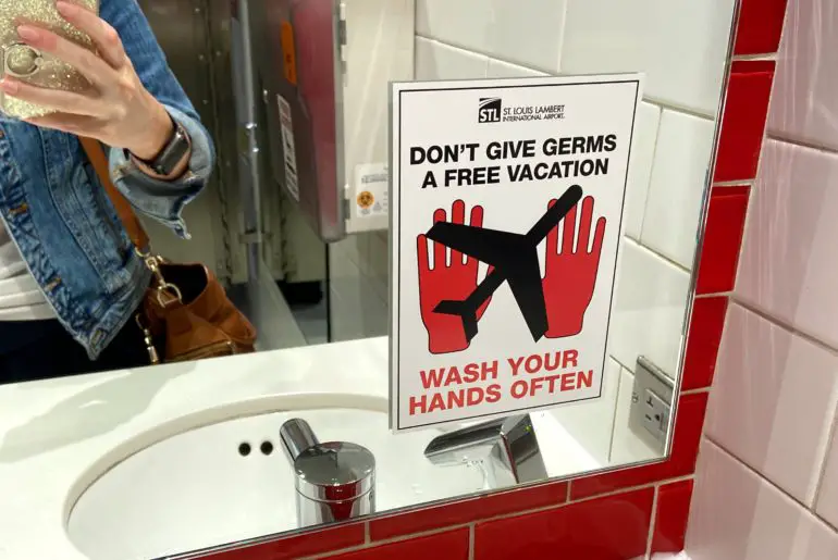 new signage at the airports reminding passengers to wash their hands