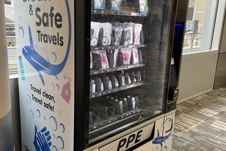 vending machines offering masks and hand sanitizer are one thing to expect when flying during covid