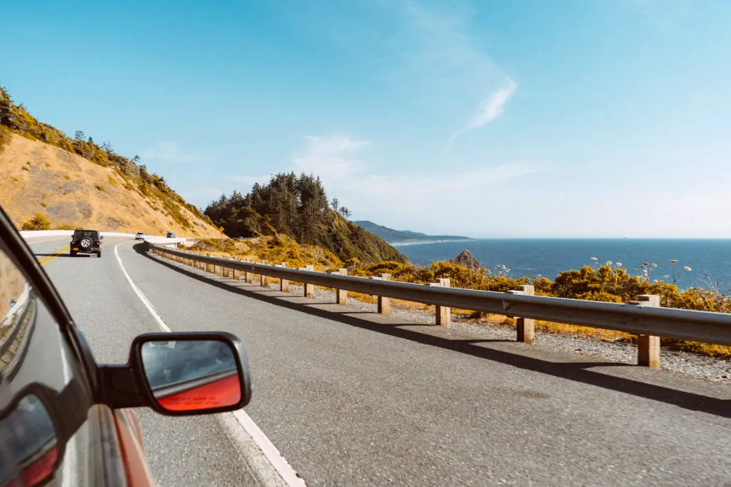 car driving along the ocean