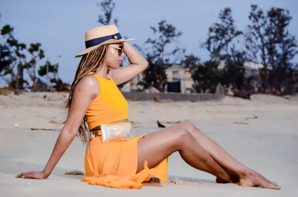 for healthy hair at the beach, embrace protective hairstyles and hats