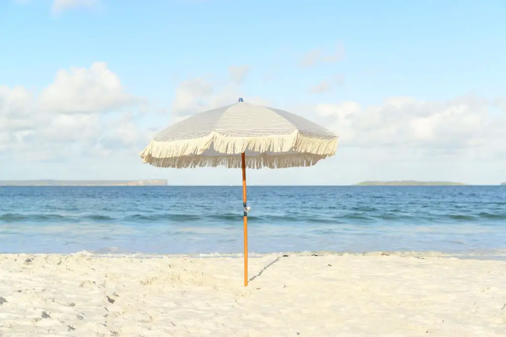 a shade tent or umbrella is a beach day essential