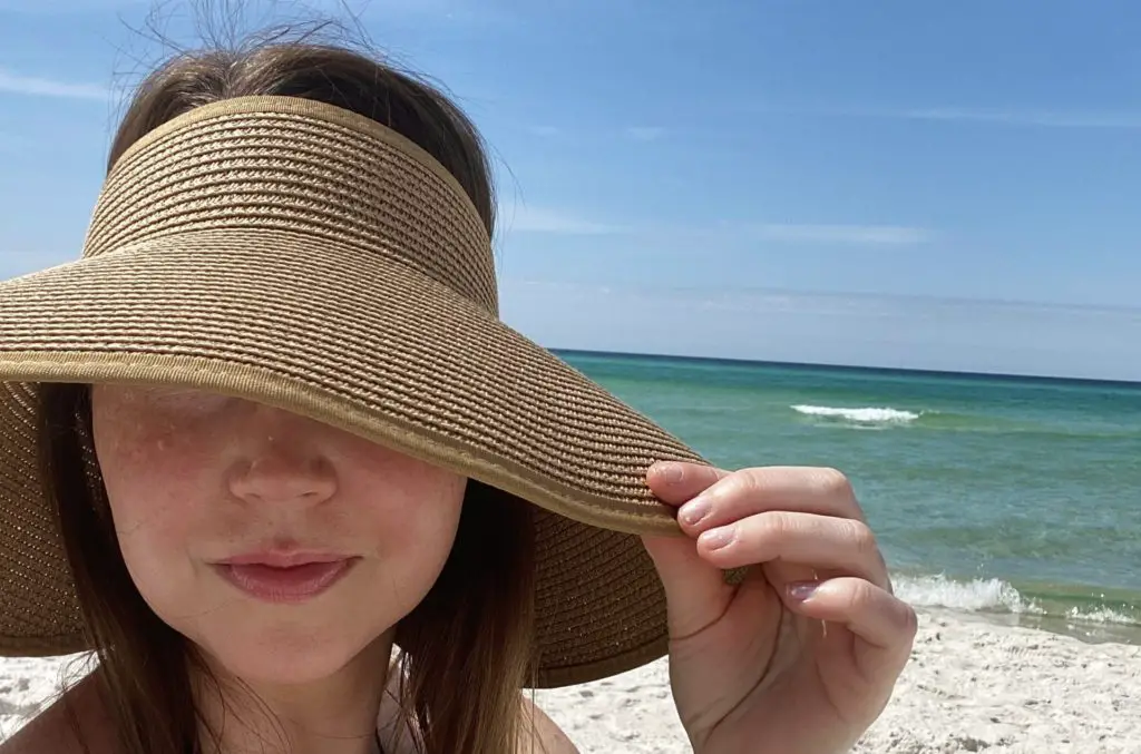 a wide brim hat is a beach day essential